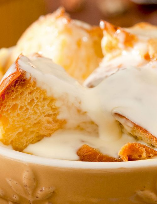 Creamy, melted sauce over warm, toasted bread cubes in a bowl&mdash;think bread pudding or a rich bread-and-cream dessert. Ends with a sweet, cozy note.